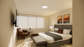 Nanaimo apartment for rent - A modern bedroom with a large bed, a chair, a table, and a painting on the wall.