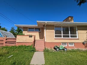 Great Falls apartment for rent - a house with a motorcycle parked in front of it