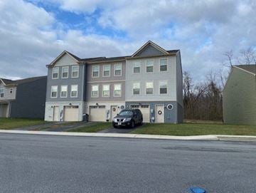 Kearneysville apartment for rent - a car parked in front of an apartment building