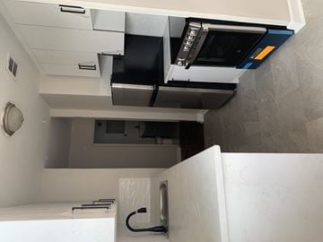 Toronto apartment for rent - an overhead view of a kitchen with a stove and a microwave
