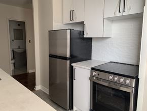 Toronto apartment for rent - a kitchen with a stove and a refrigerator