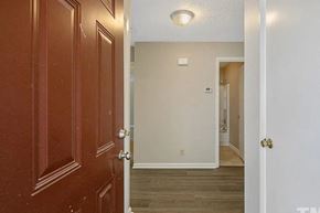 Fayetteville house for rent - a hallway with a door open to a bedroom