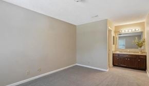 Fayetteville house for rent - an empty bathroom with a sink and a mirror