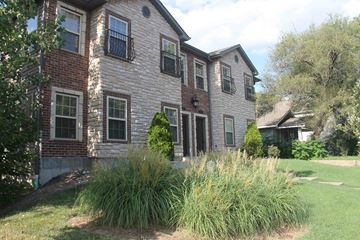 Columbia apartment for rent - a large brick house with tall grass in front of it