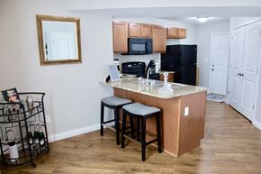 Columbia apartment for rent - a kitchen with a counter top with two stools