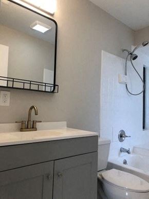 Port St. Lucie house for rent - A bathroom with a white sink and a white toilet.