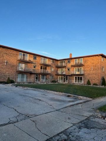 Lansing apartment for rent - a large brick apartment building on the side of a street