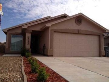 El Paso house for rent - A house with a garage and a driveway.