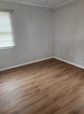 Hampton house for rent - an empty room with wooden floors and a window
