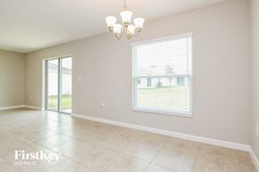Davenport house for rent - the living room and dining room of a house with a large window
