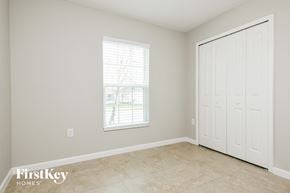 Davenport house for rent - a bedroom with a door and a window and a tiled floor