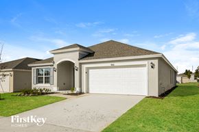 Davenport house for rent - a beige house with a white garage door