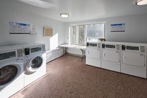 Toronto apartment for rent - A laundry room with washers and dryers.