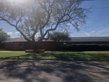 Snyder house for rent - a large tree in front of a building