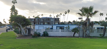 San Diego apartment for rent - a house with palm trees in front of it on the side of a street