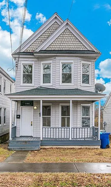Newport News apartment for rent - a white house with a porch and a blue sky