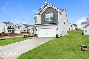 Greenville house for rent - A house with a garage is shown in the image.