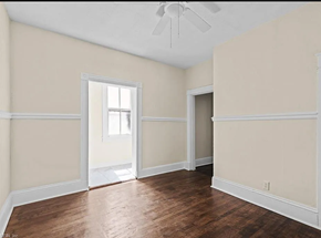 Portsmouth apartment for rent - an empty living room with wood floors and white walls