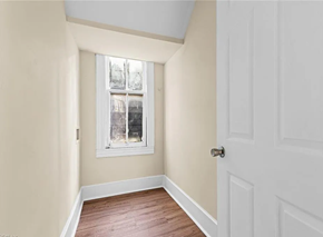 Portsmouth apartment for rent - an empty bedroom with a window and a wooden floor