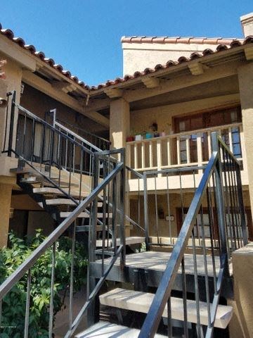 Tucson house for rent - a house with stairs and a balcony