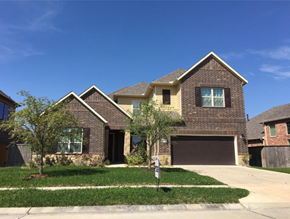 Pearland house for rent - a house with a yard and a garage