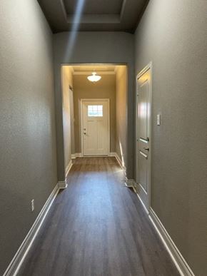 Greenville house for rent - A hallway with a light at the end.