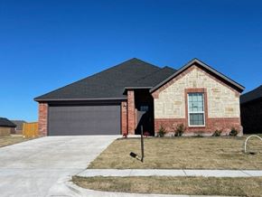 Greenville house for rent - A house with a garage and a driveway.