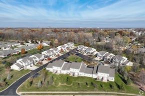 Indianapolis townhouse for rent - A bird's eye view of a residential neighborhood with houses and trees.