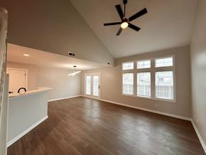 Indianapolis townhouse for rent - A room with a ceiling fan and wooden flooring.