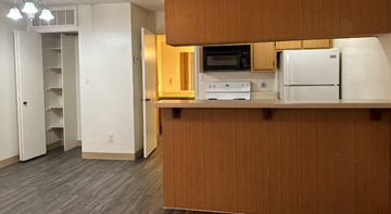 Phoenix apartment for rent - a kitchen with a stove and a refrigerator in a room