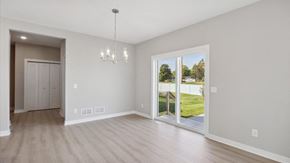 Woodbury house for rent - a living room with a large window and a door to a backyard