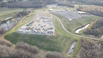 North Chesterfield apartment for rent - A parking lot with several cars and a dirt track in the middle.