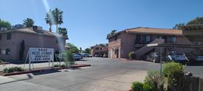 Las Vegas apartment for rent - a real estate sign sits in front of a building