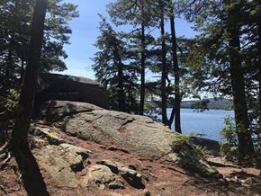Laconia apartment for rent - a large rock sitting next to a body of water