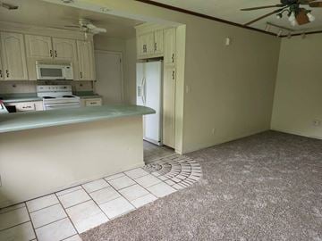 Pensacola house for rent - a kitchen with a counter and a refrigerator