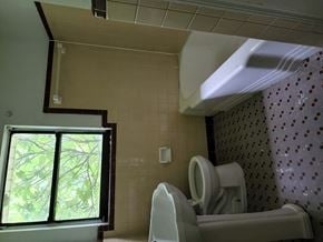 Pensacola house for rent - a bathroom with a toilet and a window