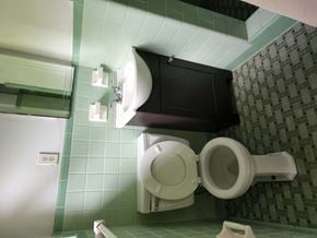 Pensacola house for rent - a bathroom with a toilet and a sink in it