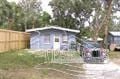 Pensacola house for rent - a blue house with a truck in front of it