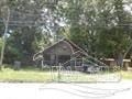 Pensacola house for rent - a house in a field next to a tree