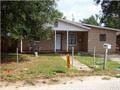Pensacola house for rent - a house with a yellow fire hydrant in front of it
