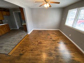 Clinton house for rent - A room with wooden flooring and a ceiling fan.