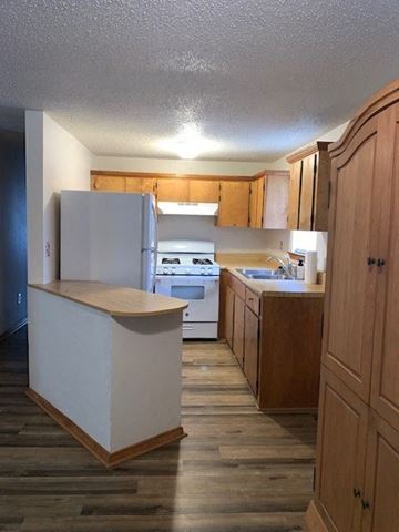 Crestview house for rent - a kitchen with a stove and a refrigerator