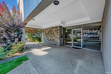 Vancouver apartment for rent - The entrance to the Stanley Manor apartment complex is shown.