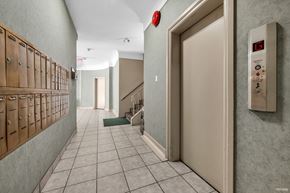 Vancouver apartment for rent - A hallway with a fire alarm on the wall.