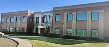 Canton apartment for rent - a large brick building with windows and a sidewalk
