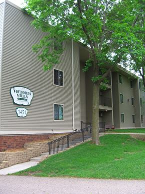 Stillwater apartment for rent - an apartment building with a sign on the side of it