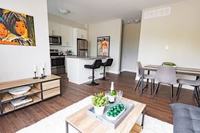 Ottawa apartment for rent - A modern kitchen with a dining table and chairs.