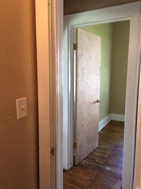 Windsor house for rent - a hallway with a door to a room with a tile floor
