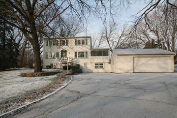 Rochester house for rent - A large house with a driveway in front of it.