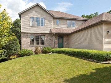 Rochester house for rent - a house with a yard in front of it